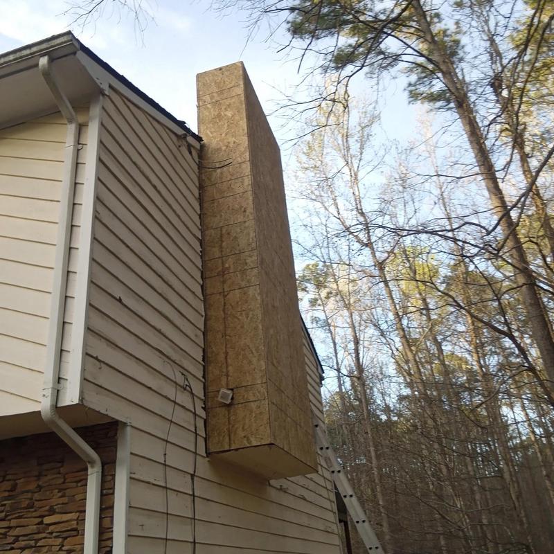 Chimney reframing with plywood sheathing on siding