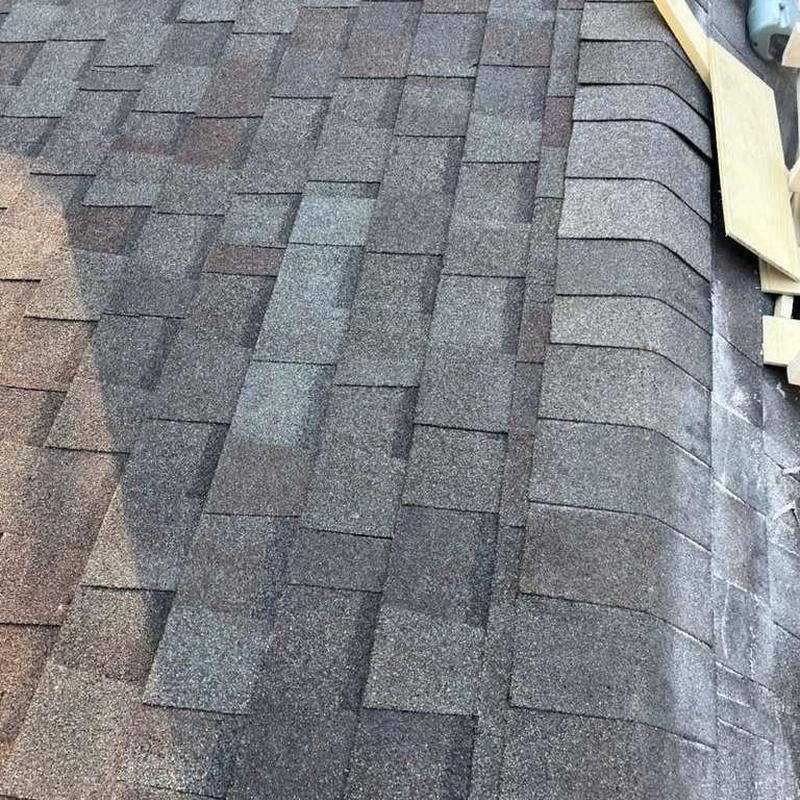 Asphalt roof shingles replacement near chimney flashing