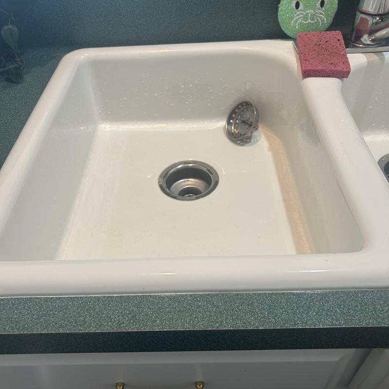 Kitchen sink drain with clean opening and strainer