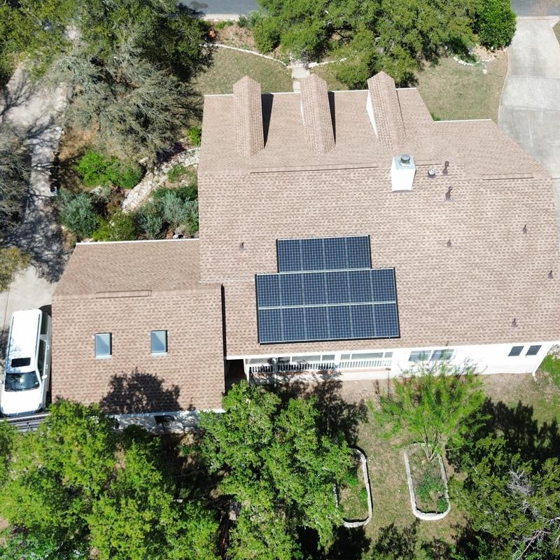 Solar panel array on roof with GAF shakewood shingles Solar panel array on roof with GAF shakewood shingles