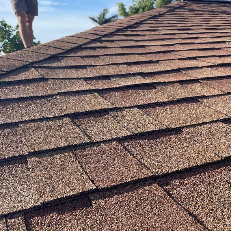 Owens Corning shingle roof with damaged areas