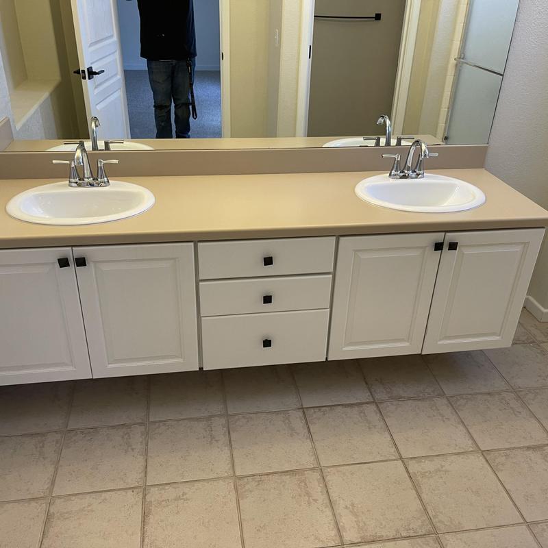 Double bathroom sinks with new faucets and cabinetry