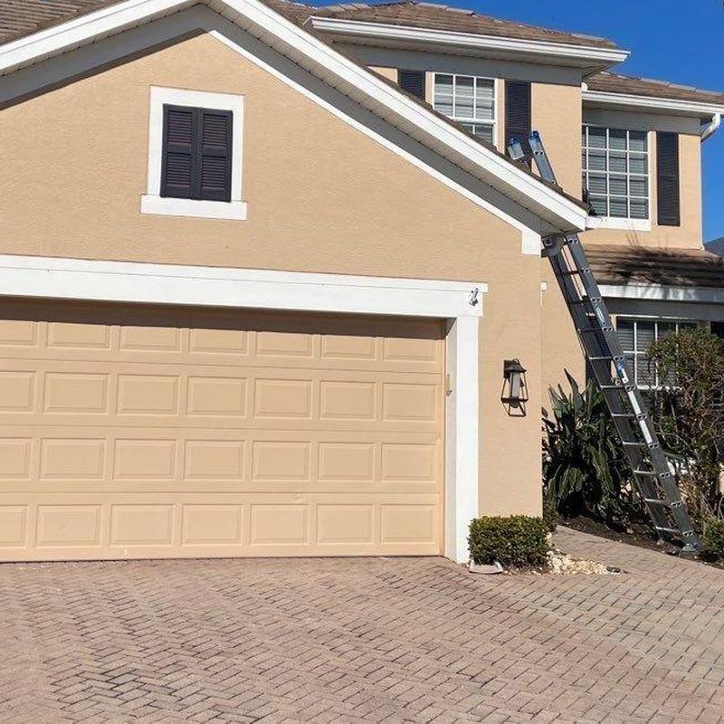 Concrete tile roof with inspection ladder on house
