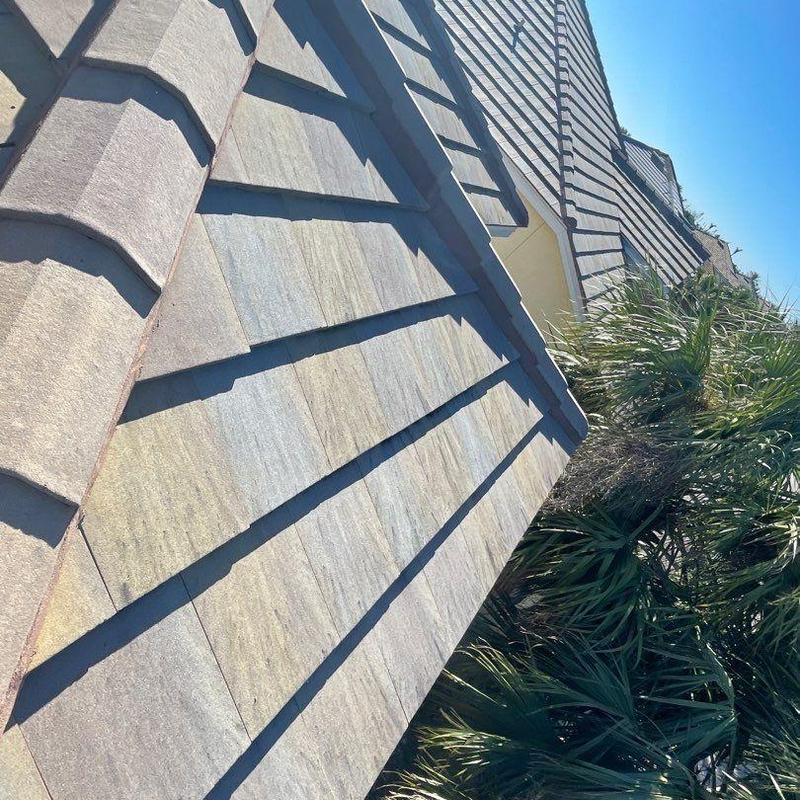 Concrete tile roof with cracked and slipping tiles
