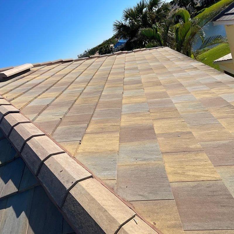 Concrete tile roof with cracked and slipping tiles