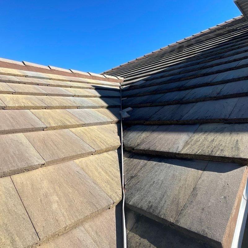 Concrete tile roof with cracked and slipping tiles
