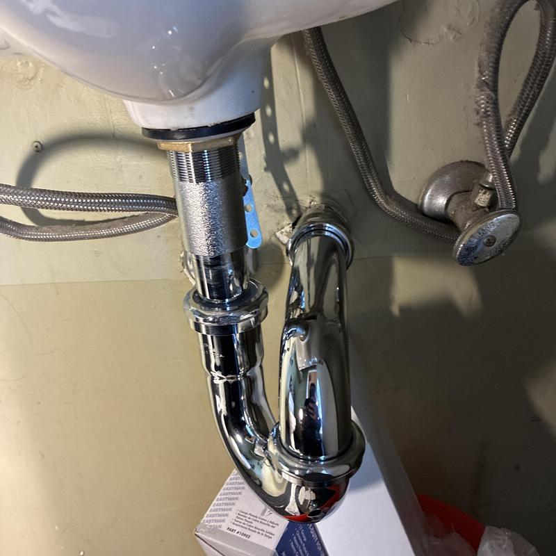 Bathroom sink P-trap and drain assembly replacement