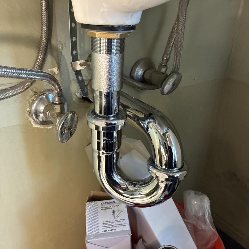 Bathroom sink P-trap and pop-up drain assembly installation