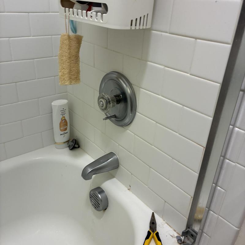 Shower handle and knob reinstalled with adjustment screw