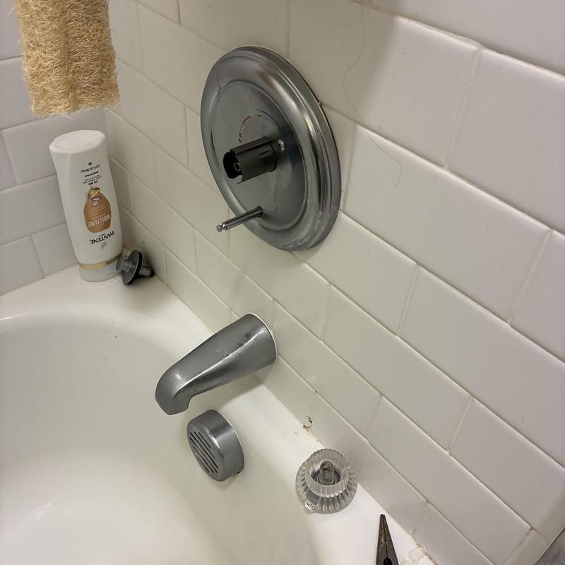 Shower handle knob removed for faucet repair in bathroom