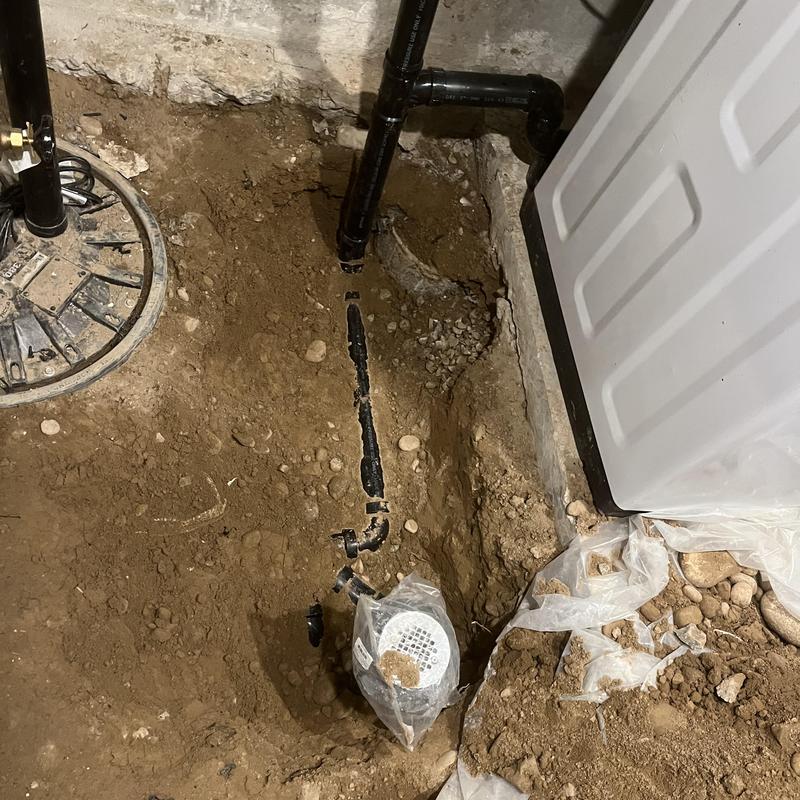 Sewage ejection pump basin with new piping installation