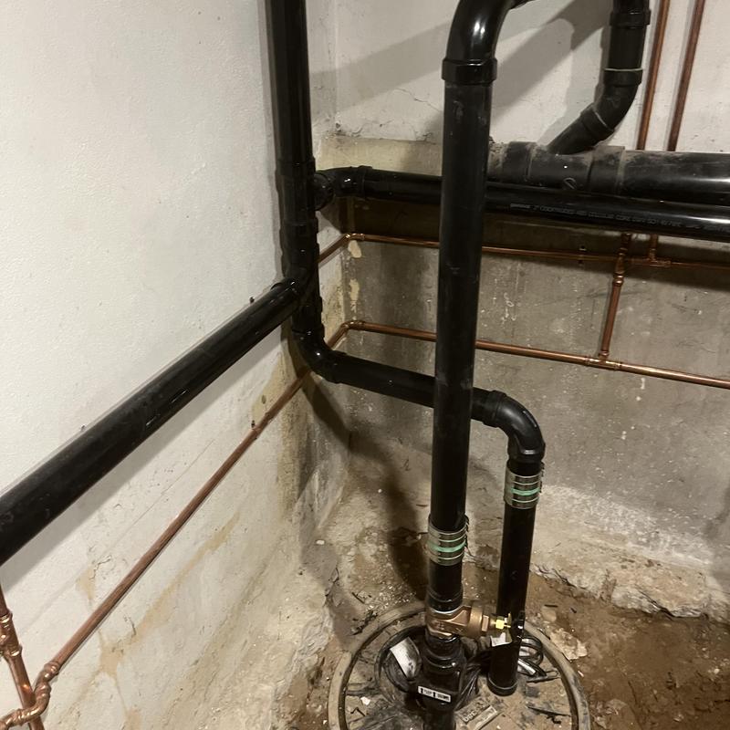 Sewage ejection pump basin with new piping installation