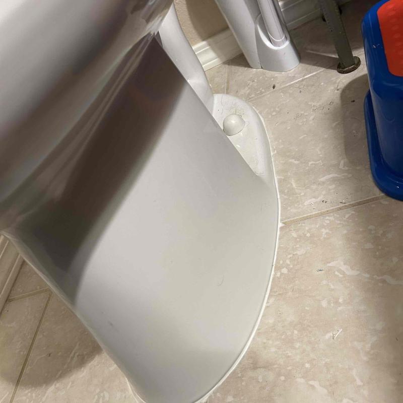 Toilet base and floor drain cleaning in bathroom corner