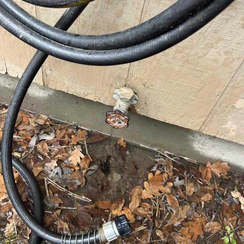 Outside faucet with hose connection and soil patch