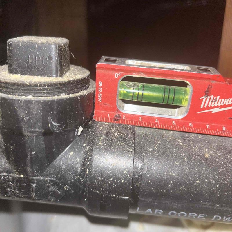 Discharge line level check on plumbing system