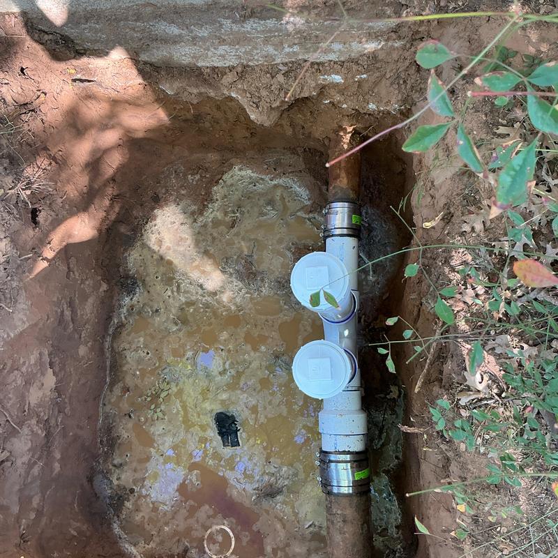 Two-way clean outs installed on sewer line in yard