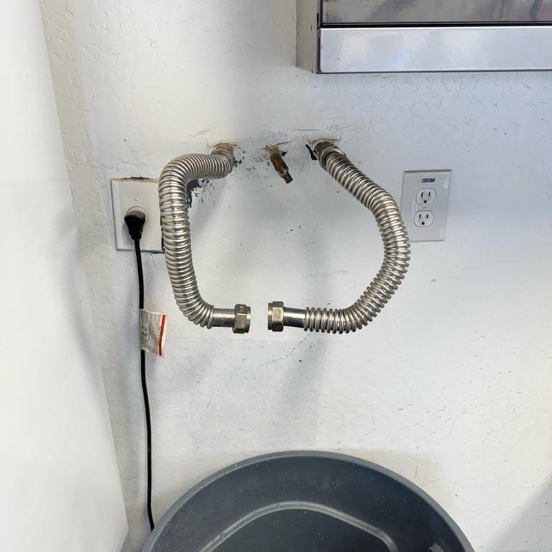 Water softener loop disconnected with flexible hoses