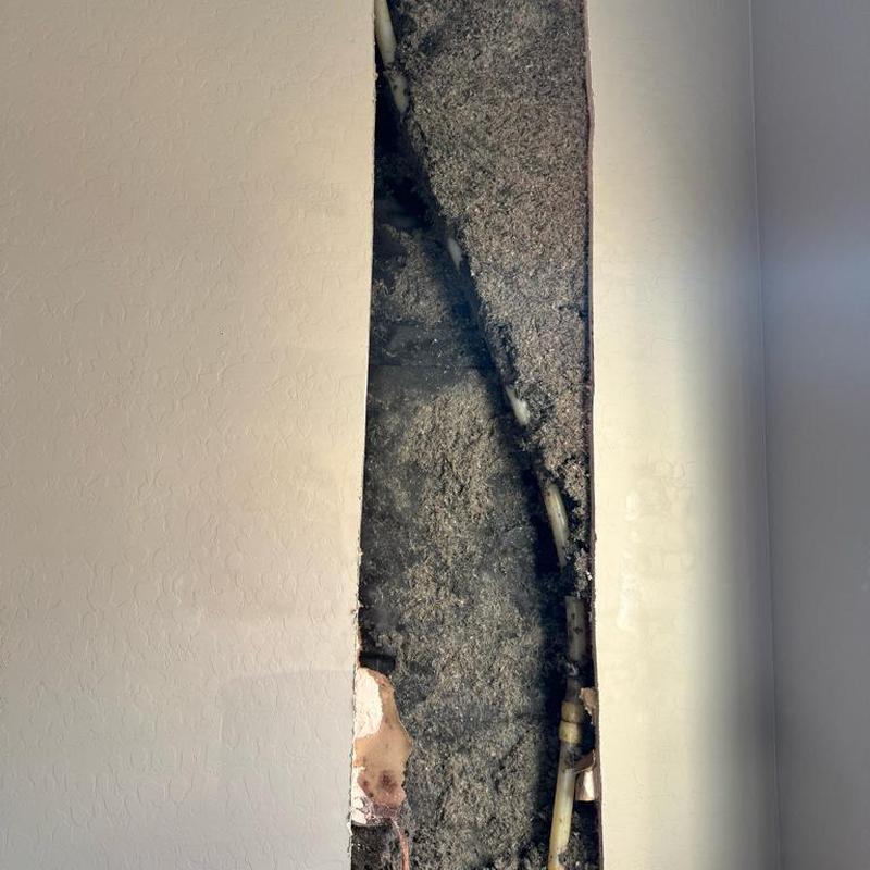 PEX water pipe with insulation and wall cutout exposed