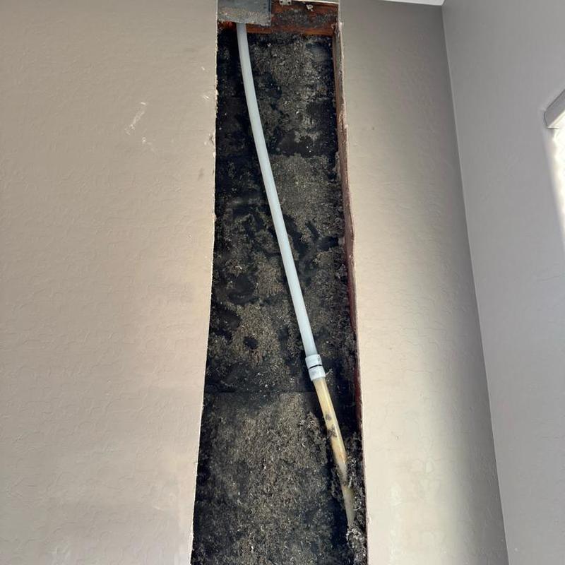 PEX pipe with new 90° fitting inside wall cutout