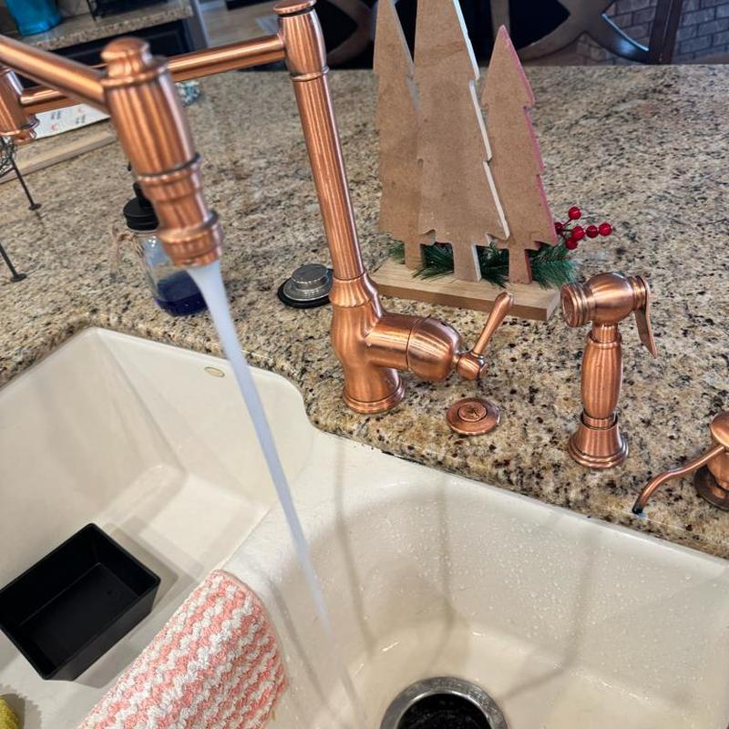 Kitchen sink faucet with running water and sprayer