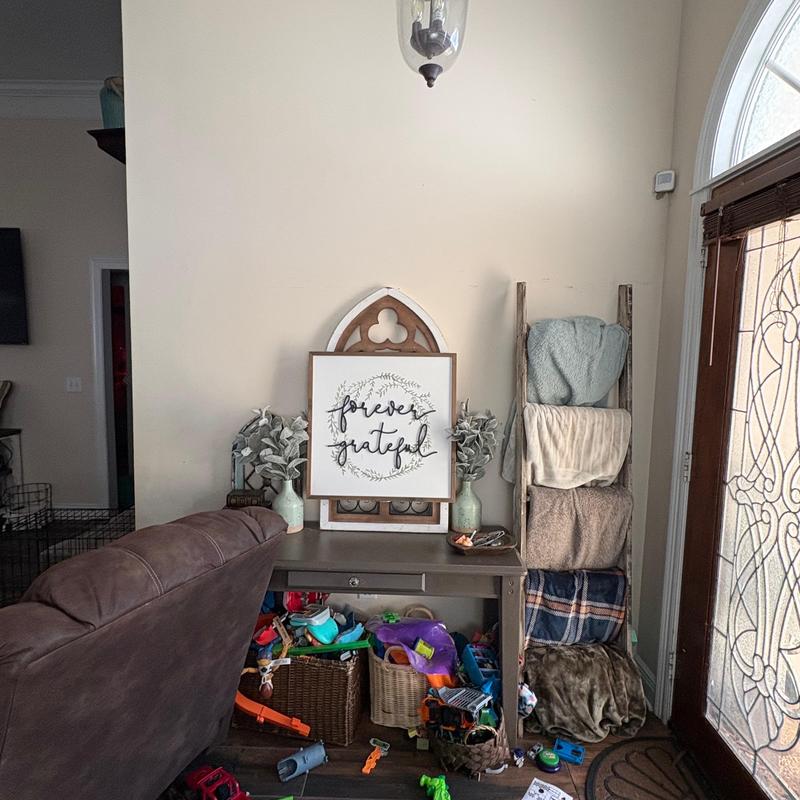 Board and batten decorative wall installation near entryway