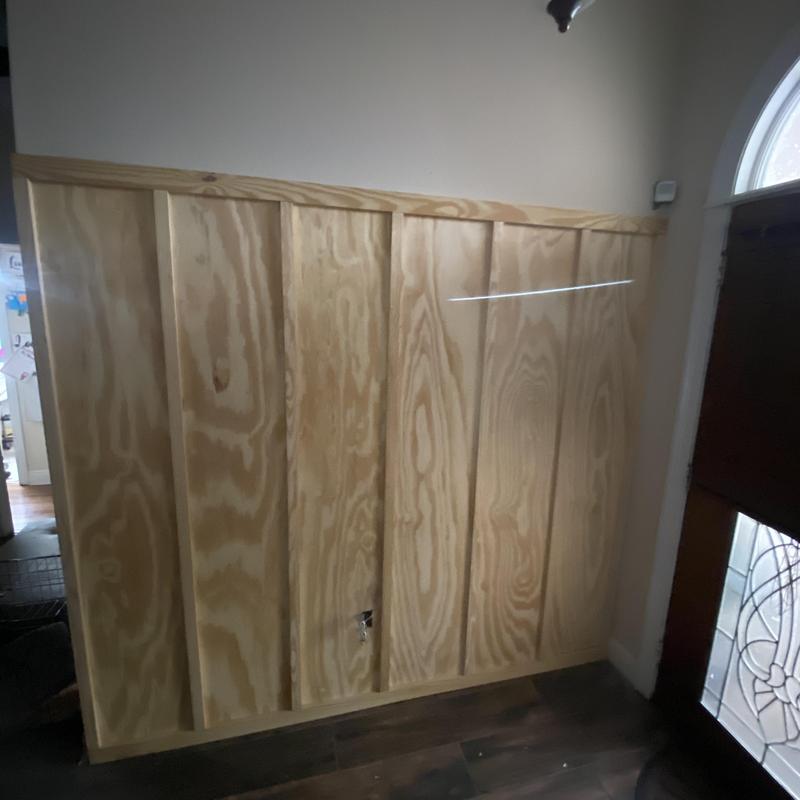 Board and batten decorative wall installation in foyer