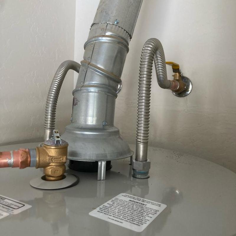 Bradford White gas water heater with valve and flex lines