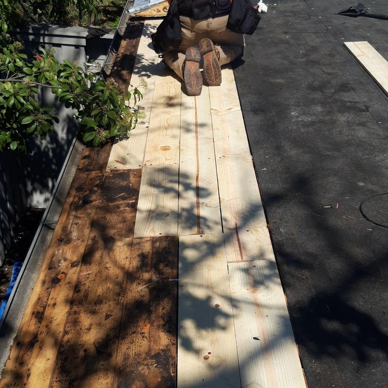 Roof decking replacement with new wood boards