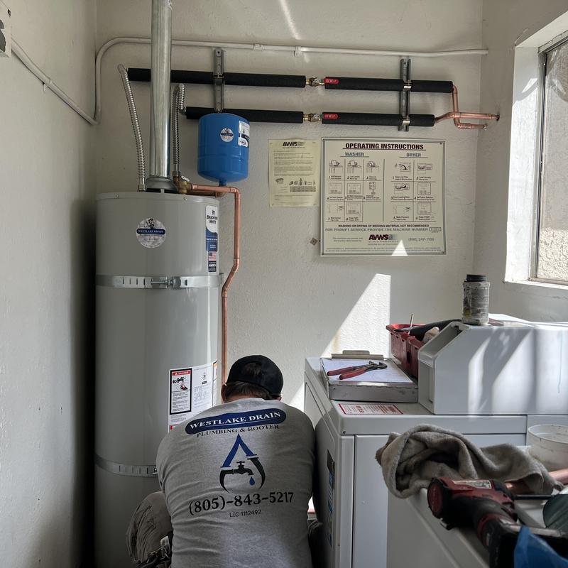 Water heater installation in community laundry room