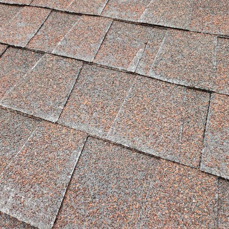 Asphalt roof shingles with granular loss and blistering Asphalt roof shingles with granular loss and blistering