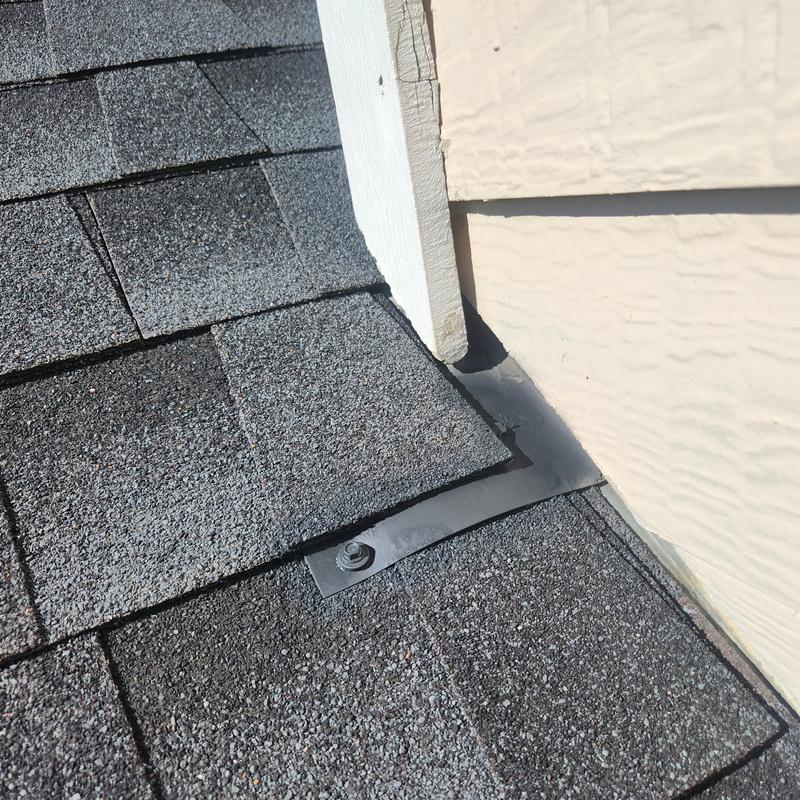 Chimney cricket and flashing with sealed fasteners