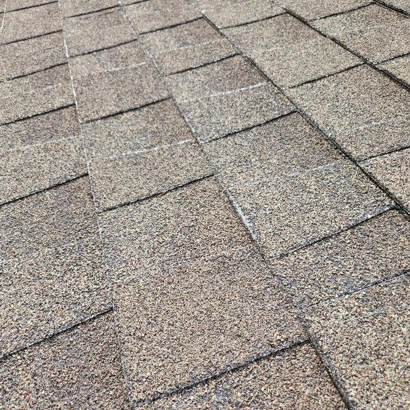 Shingles with granular loss and blistering on roof Shingles with granular loss and blistering on roof