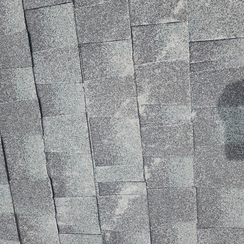 Roof shingles showing damage and wear close-up