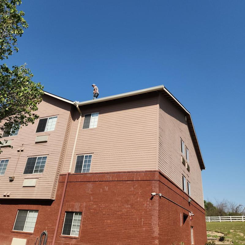 Gutter and downspout system on three-story building