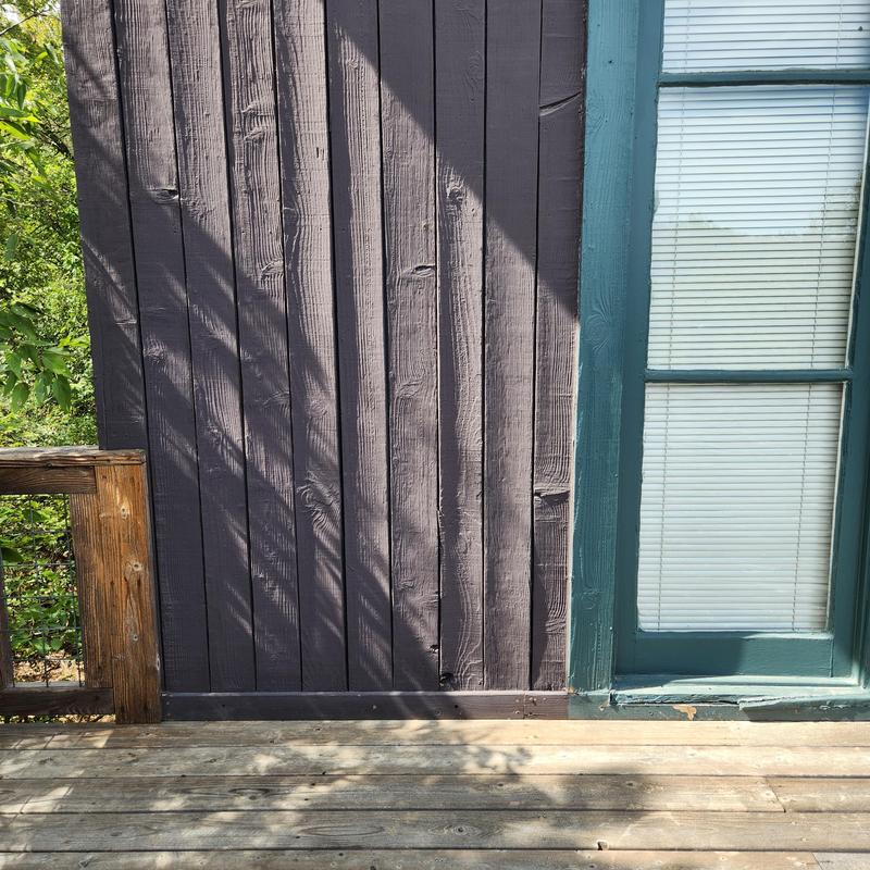 Wood siding and door threshold with leak signs