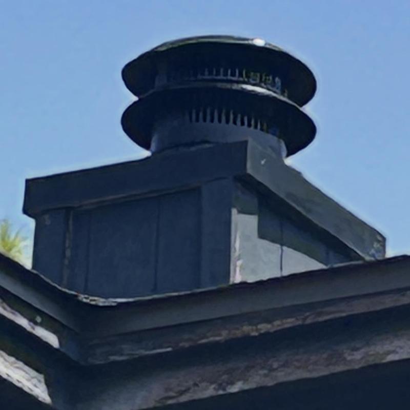 Chimney cap with refurbished sealing on roof edge