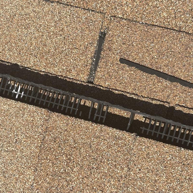 Roof shingle gap exposing underlying metal lath structure