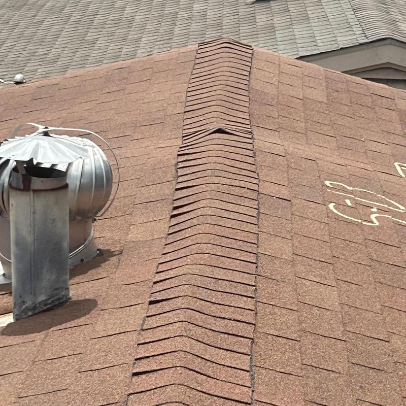 Roof shingles with ridge vent and attic turbine vent