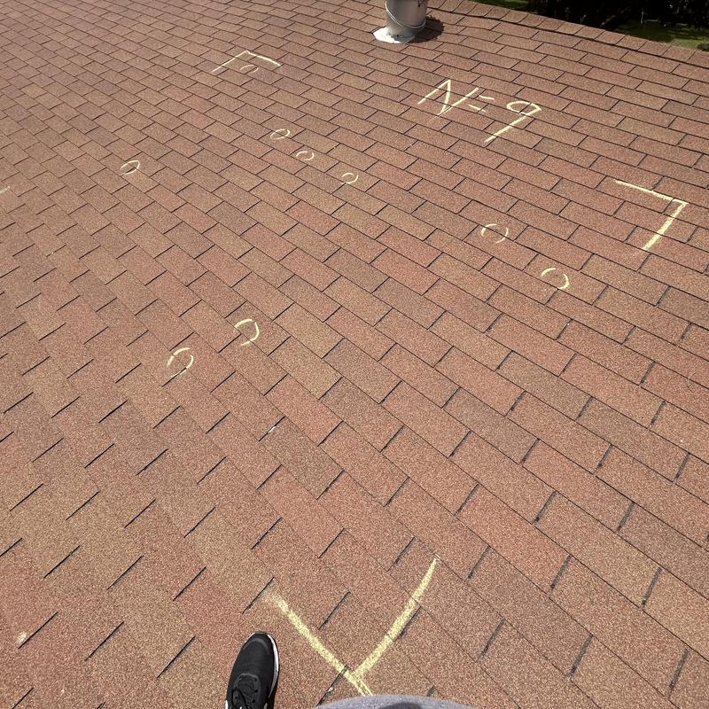 Roof shingles with chalk marks for inspection in Fort Worth