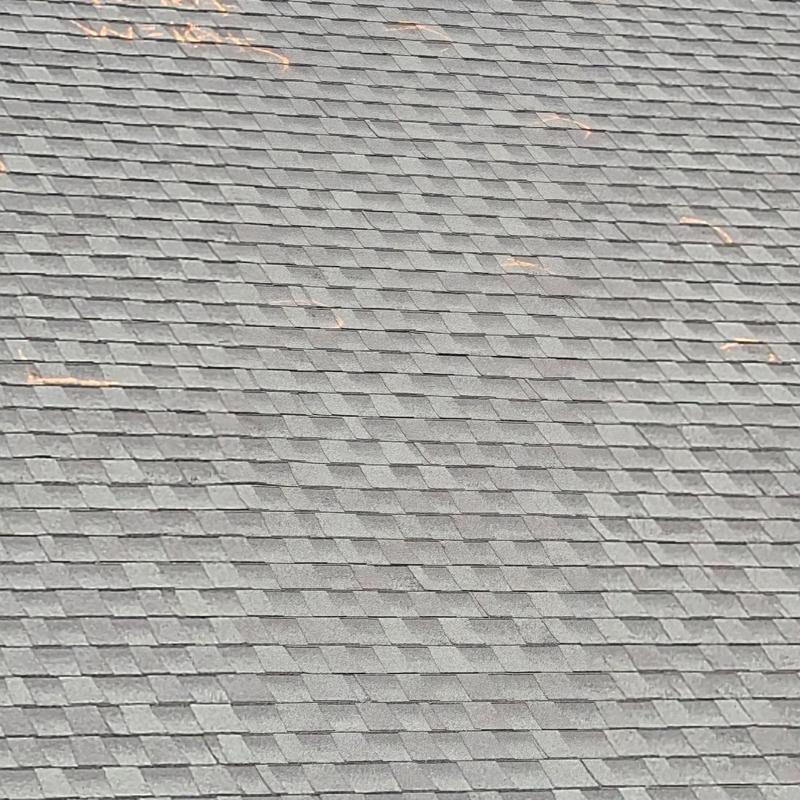 Roof shingles with marked hail damage spots