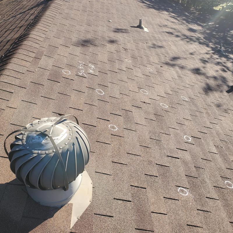 Roof shingles with hail damage marked in Terrell TX