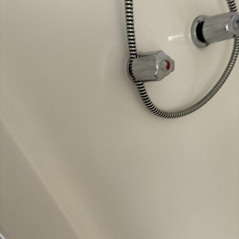 Toilet flapper valve and flush handle in bathroom tank