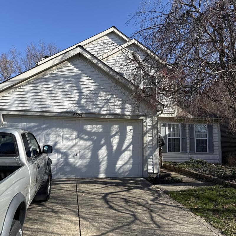 Roof shingles missing on residential home exterior Roof shingles missing on residential home exterior