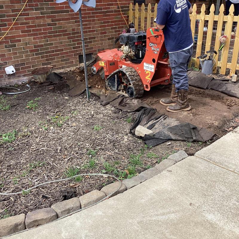 Galvanized service line replacement with trenching machine