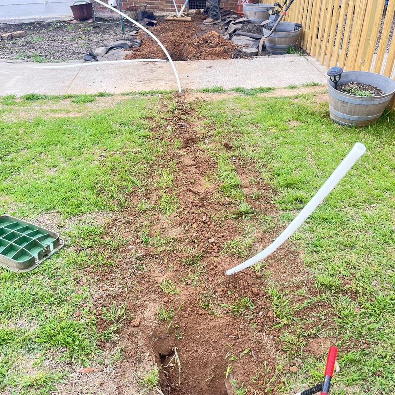 Galvanized service line trench excavation with new pipe