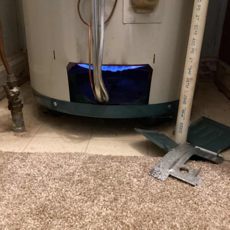 Water heater pilot light burning inside housing panel removal