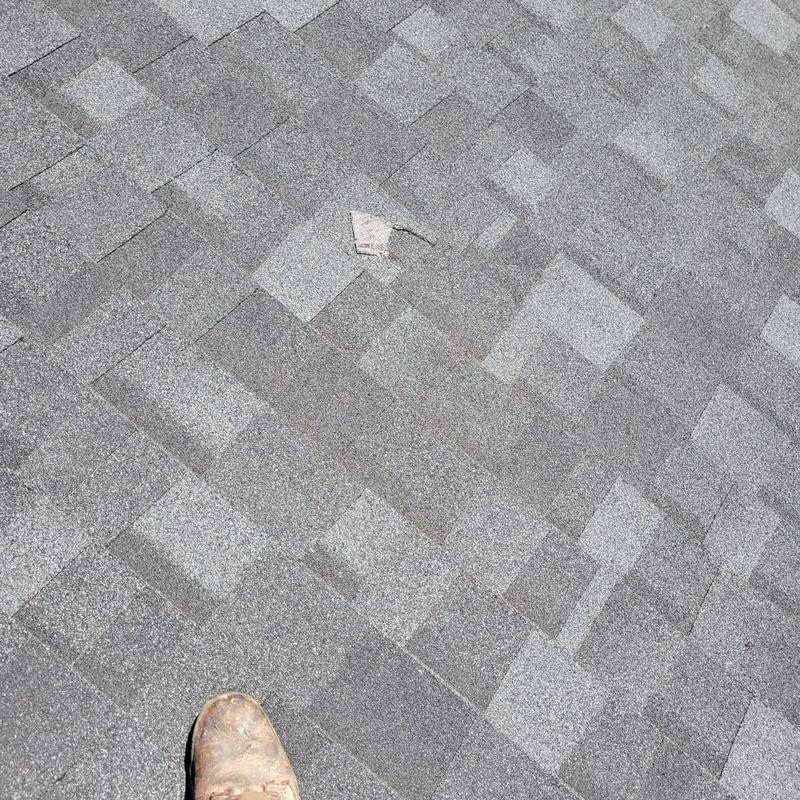 Shingle roof with minor damage and worn spot