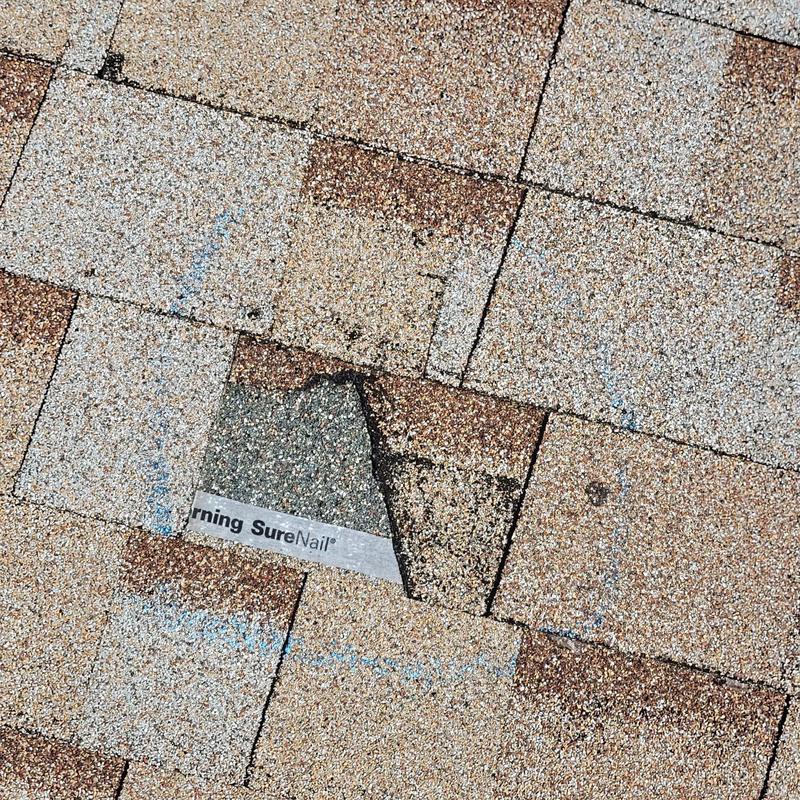 Shingle roof with damaged and missing granules