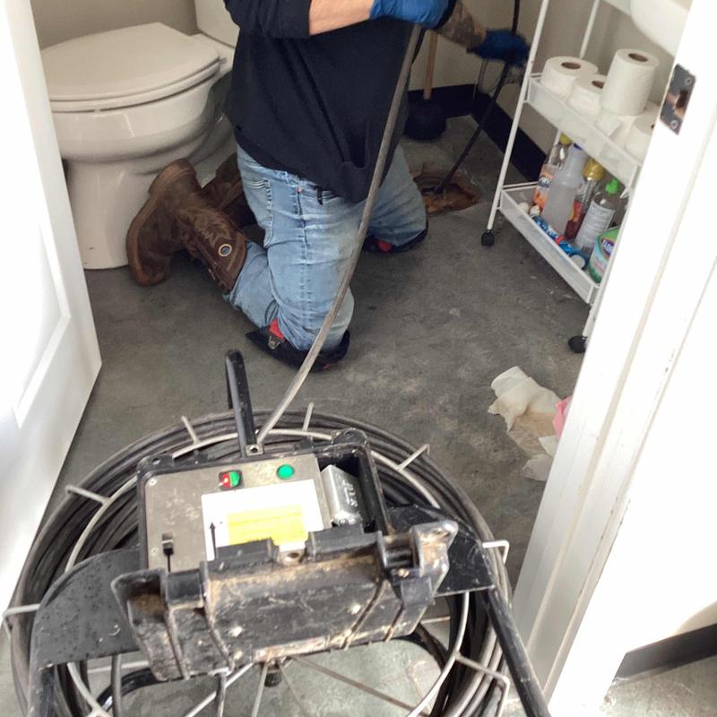 Sewer line camera inspection in residential bathroom