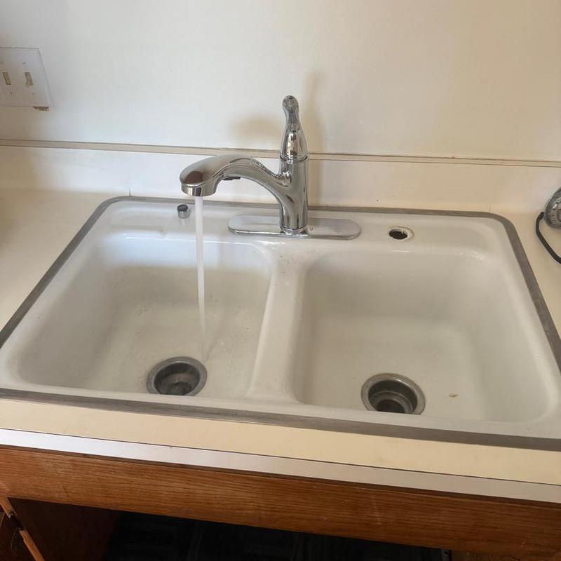 Kitchen faucet and double basin sink with running water